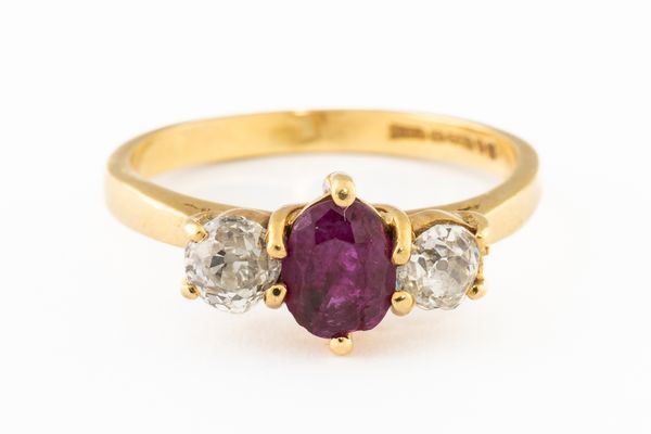 AN 18CT GOLD, RUBY AND DIAMOND THREE STONE RING