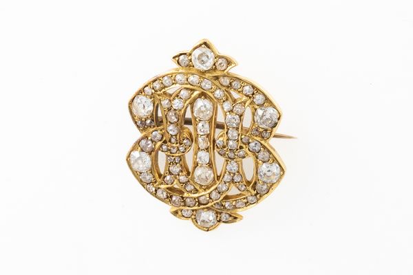 A YELLOW GOLD AND DIAMOND BROOCH