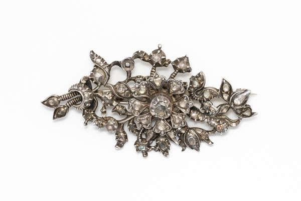 A SILVER AND  DIAMOND BROOCH