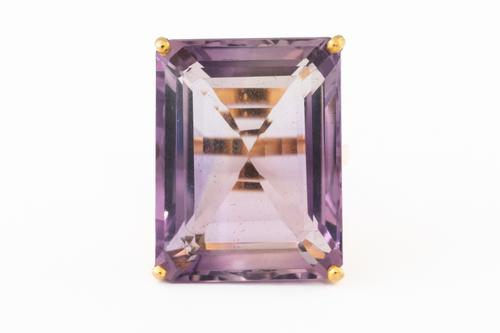 A LARGE AMETHYST SINGLE STONE RING