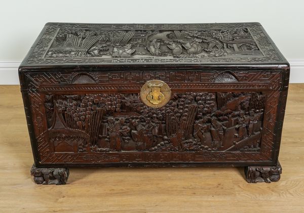 AN EARLY 20TH CENTURY EASTERN EXPORT EXTENSIVELY CARVED CAMPHOR WOOD TRUNK