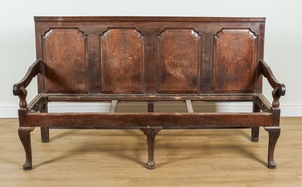 A GEORGE III RED WALNUT FOUR PANEL BACK OPEN ARM SETTLE