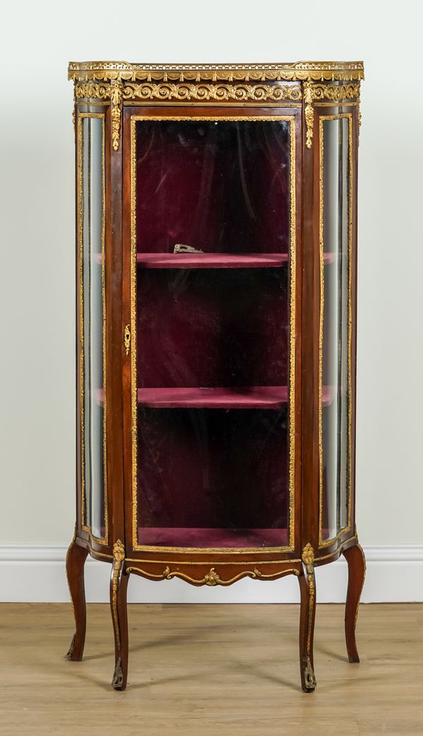 A LOUIS XVI STYLE GILT METAL MOUNTED BOWFRONT VITRINE