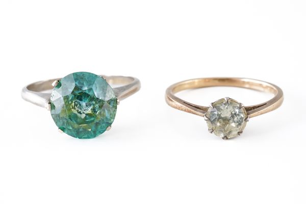 A BLUE ZIRCON SINGLE STONE RING AND ANOTHER RING (2)