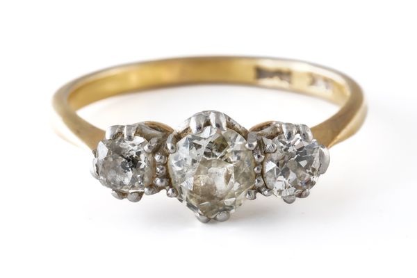 A GOLD AND PLATINUM, DIAMOND THREE STONE RING