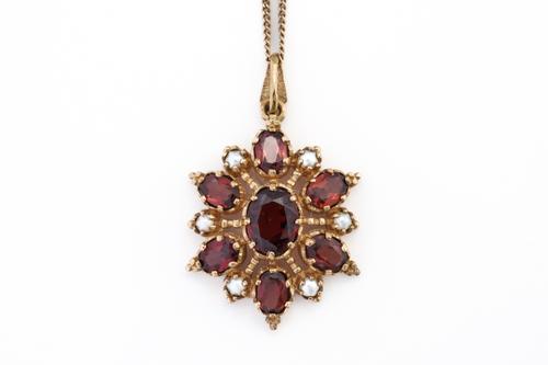 A GOLD, GARNET AND HALF PEARL SET HEXAGONAL PENDANT, WITH A 9CT GOLD NECKCHAIN (2)