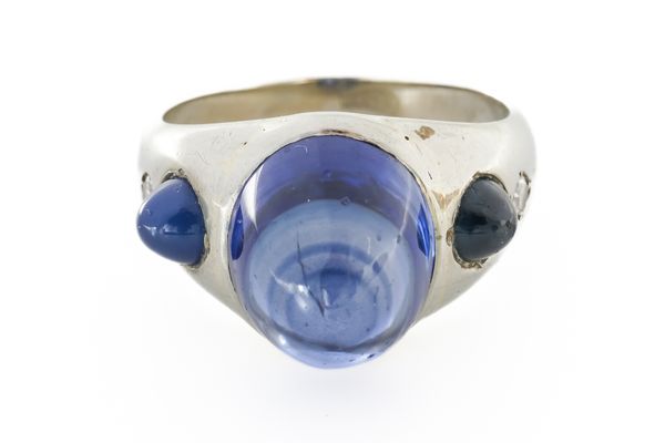 A WHITE GOLD, CABOCHON SAPPHIRE AND DIAMOND RING