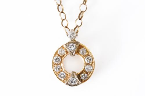 A GOLD AND DIAMOND SET SMALL CIRCULAR PENDANT, WITH A 9CT GOLD NECKCHAIN (2)