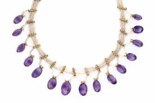 AN AMETHYST AND SEED PEARL GRADUATED COLLAR NECKLACE
