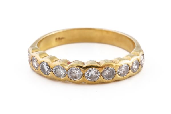 A GOLD AND DIAMOND TEN STONE HALF ETERNITY RING