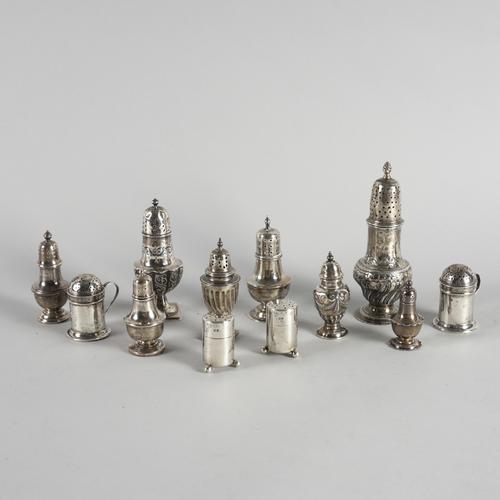 A COLLECTION OF ONE SILVER CASTER AND ELEVEN PEPPERETTES (12)
