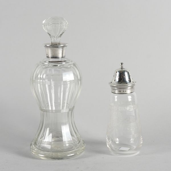 A SILVER MOUNTED FACETED GLASS DECANTER AND A SILVER MOUNTED GLASS SUGAR CASTER (2)