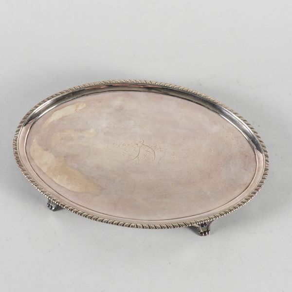 A GEORGE III SILVER OVAL SALVER