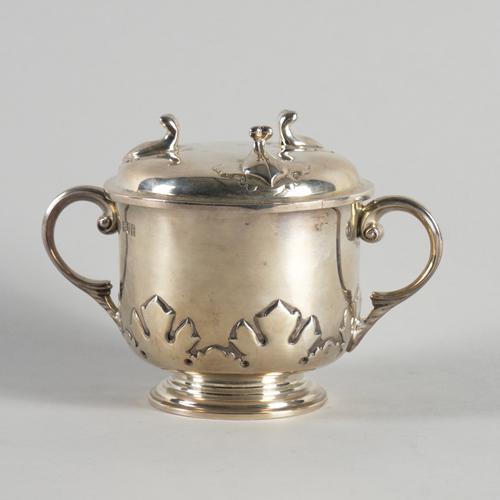 A SILVER TWIN HANDLED PORRIGER AND COVER (2)