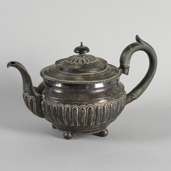 A GEORGE III SILVER TEAPOT