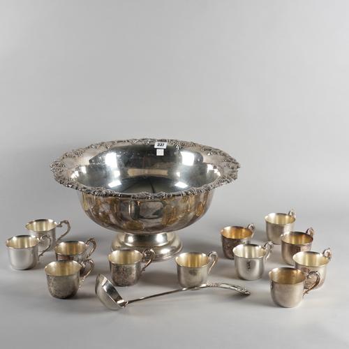 A LARGE SILVER PLATED PUNCH BOWL, LADLE AND TWELVE PUNCH CUPS (14)