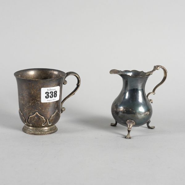 A SILVER MUG AND A SILVER CREAM JUG (2)