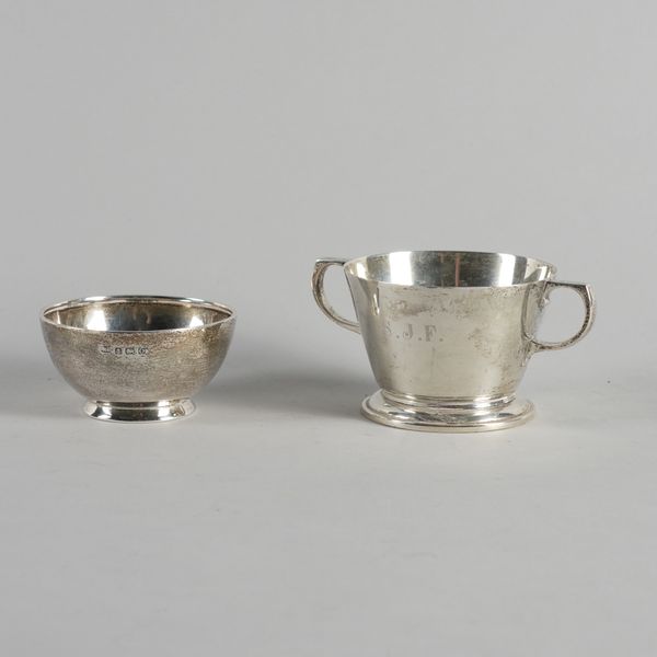 A SILVER TWIN HANDLED BOWL AND A SMALLER SILVER BOWL (2)