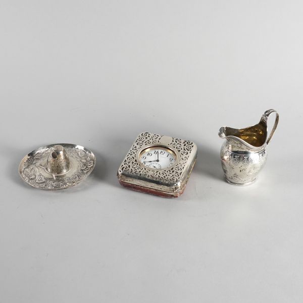 A SILVER MILK JUG, A SILVER MOUNTED TRAVELLING WATCH CASE AND A MEXICAN DISH  (3)