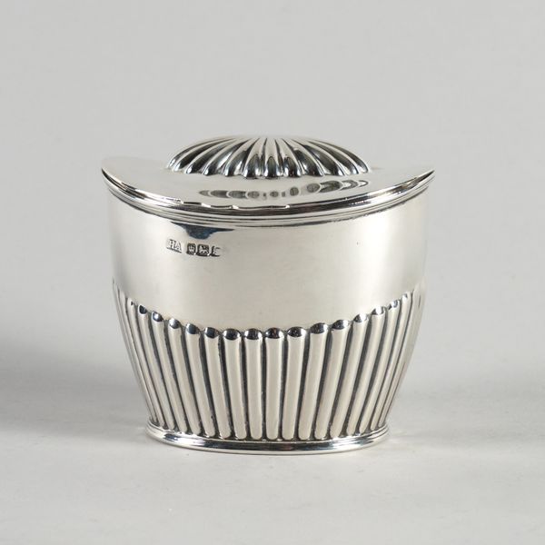 A SILVER TEA CADDY