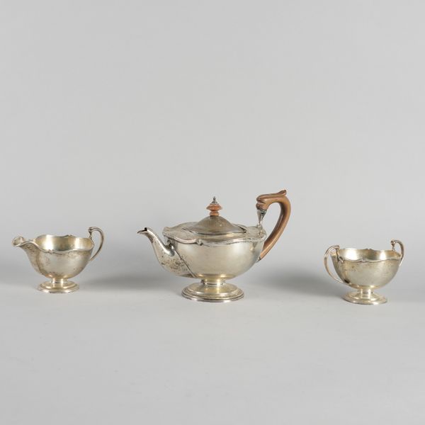 A SILVER THREE PIECE TEA SET