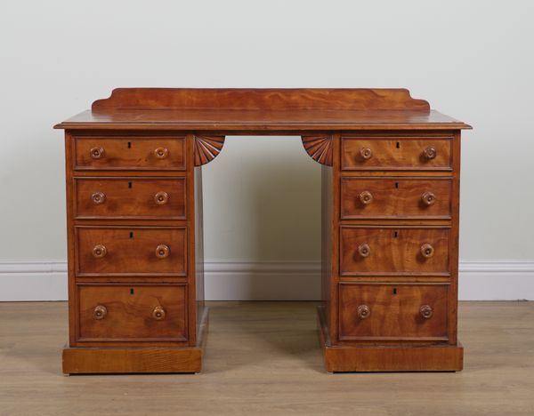 A VICTORIAN SATINWOOD EIGHT DRAWER PEDESTAL WRITING DESK