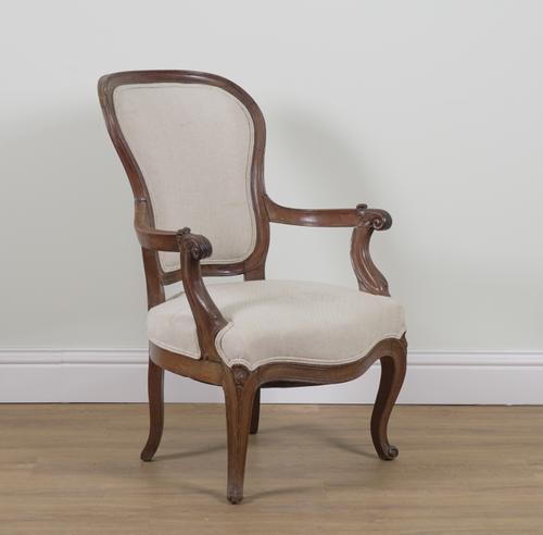A LOUIS XV STYLE WALNUT OPEN ARMCHAIR