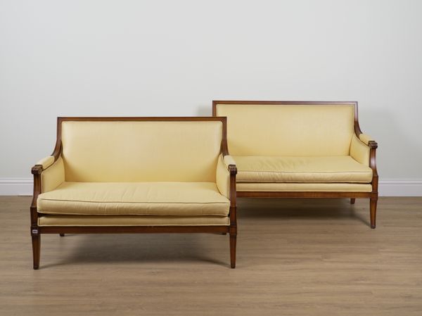 A PAIR OF LOUIS XVI STYLE STAINED BEECH TWO SEAT SOFAS (2)