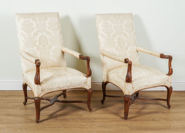 A PAIR OF LOUIS XV STYLE CARVED WALNUT FRAMED SQUARE BACK OPEN ARMCHAIRS (2)