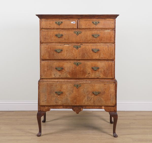 A GEORGE II FEATHER BANDED WALNUT FIVE DRAWER CHEST ON SINGLE DRAWER STAND