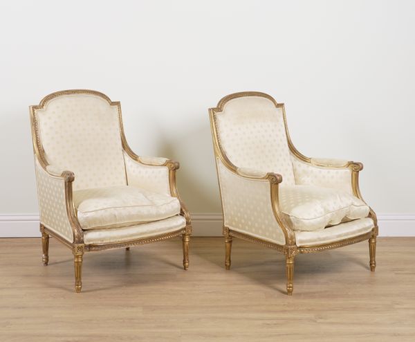 A PAIR OF LOUIS XVI STYLE GILT FRAMED OPEN ARMCHAIRS (2)