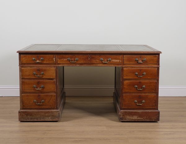 A 19TH CENTURY MAHOGANY NINE DRAWER PEDESTAL DESK