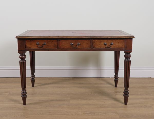 A REGENCY STYLE MAHOGANY THREE DRAWER WRITING DESK