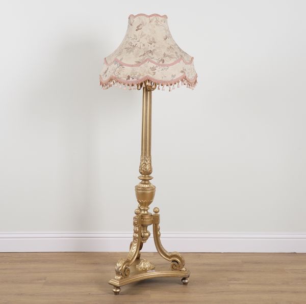 A REGENCY STYLE GOLD PAINTED STANDARD LAMP