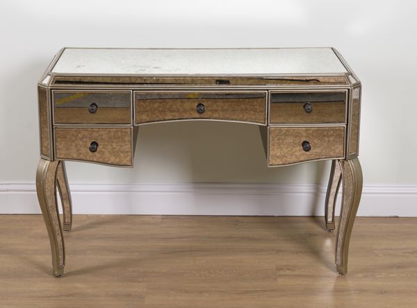 A MIRRORED FIVE DRAWER DRESSING TABLE