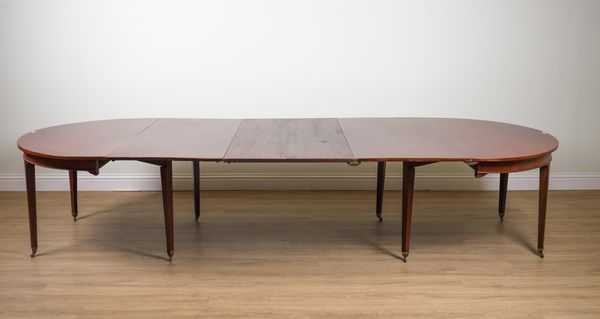 A GEORGE III MAHOGANY D-END EXTENDING DINING TABLE