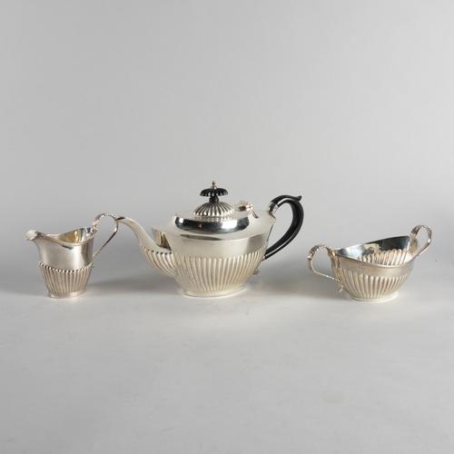 A SILVER THREE PIECE TEA SET