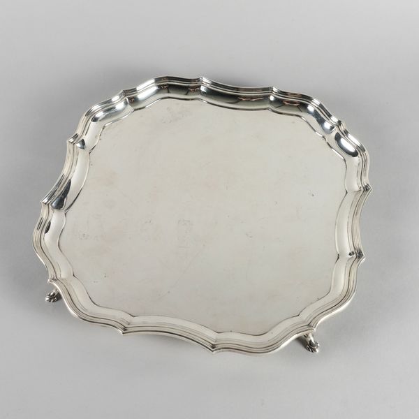 A LARGE SQUARE SHAPED SILVER SALVER