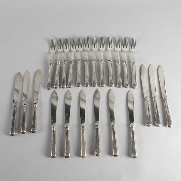 A SET OF TWELVE PAIRS OF SILVER FISH KNIVES AND FORKS