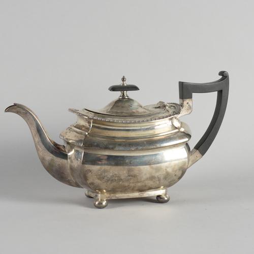 A SILVER TEAPOT