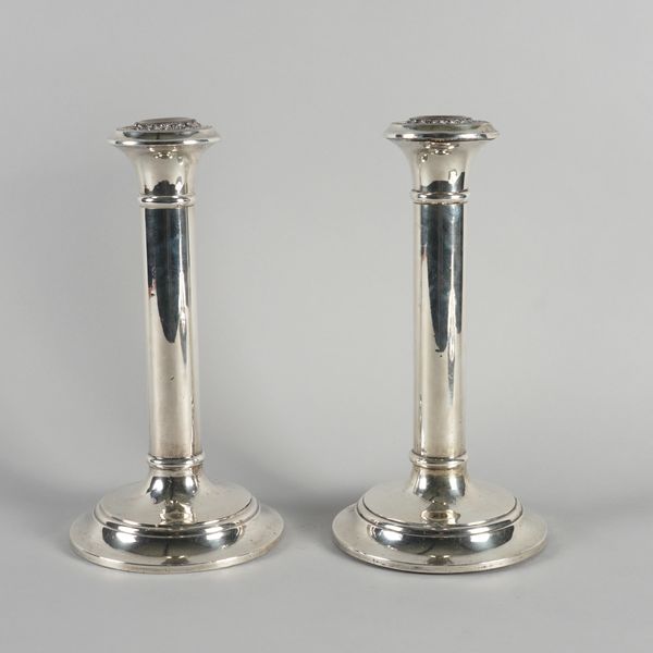 A PAIR OF SILVER TABLE CANDLESTICKS