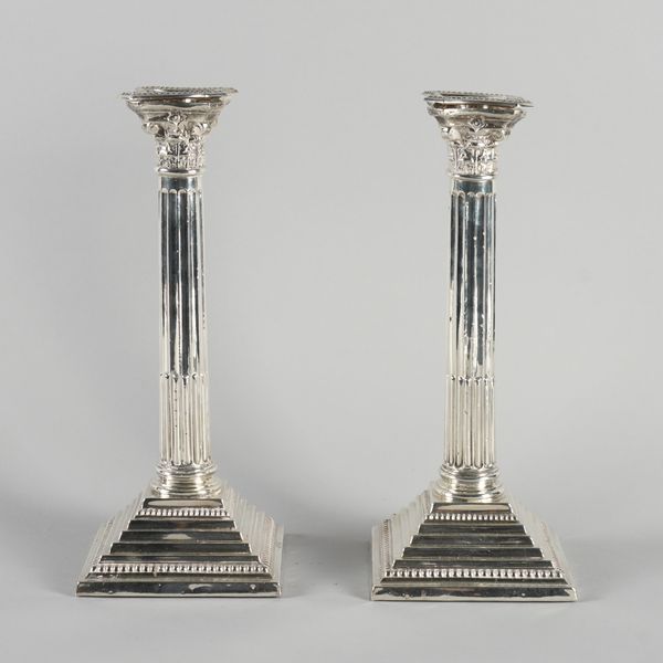 A PAIR OF SILVER TABLE CANDLESTICKS