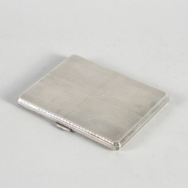 A SILVER CIGARETTE CASE