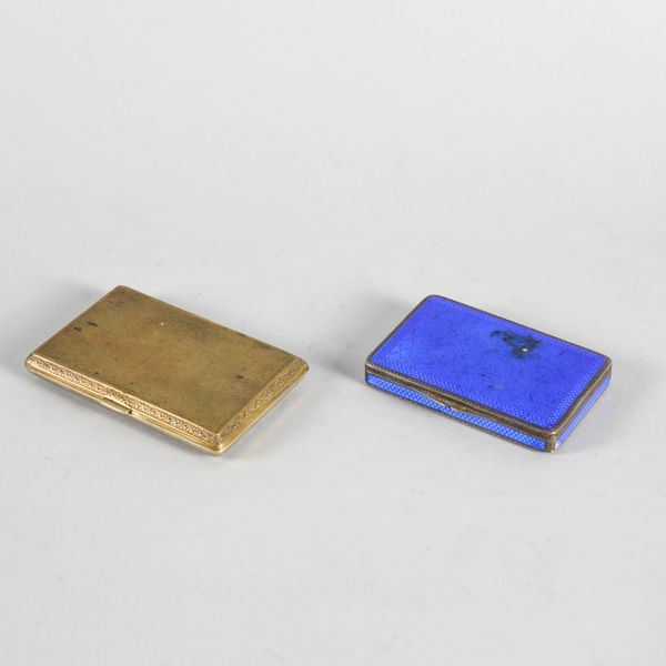 A SILVER AND DARK BLUE ENAMELLED LADIES CIGARETTE BOX AND A CIGARETTE CASE (2)