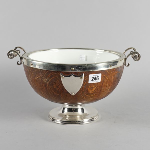 A SILVER PLATED METAL MOUNTED OAK TWIN HANDLED SALAD BOWL