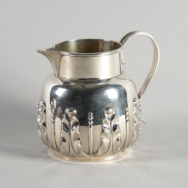 A VICTORIAN SILVER JUG