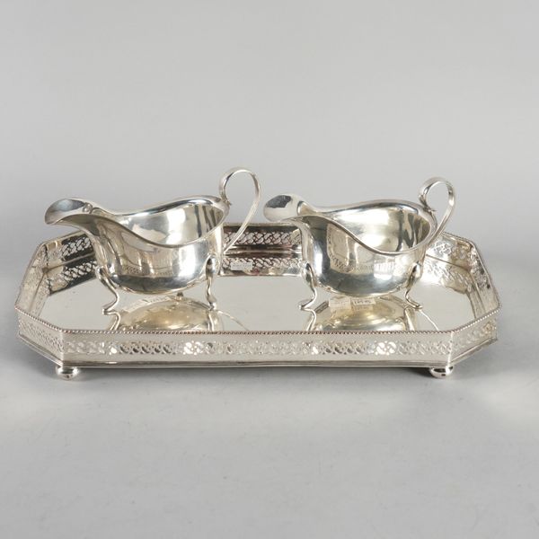 A PAIR OF SILVER SAUCE BOATS AND A PLATED TRAY (3)