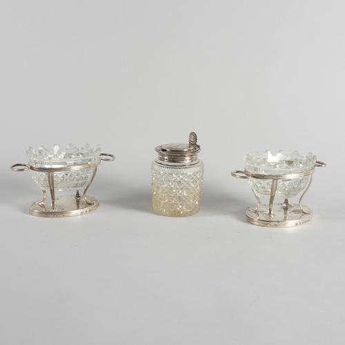 A PAIR OF GEORGE III SILVER TWIN HANDLED SALT FRAMES AND A SILVER MOUNTED GLASS MUSTARD POT (3)