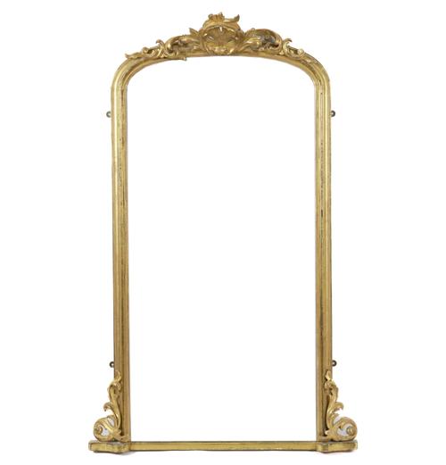 A VICTORIAN GILT FRAMED ARCH TOPPED OVERMANTEL MIRROR