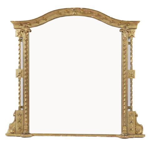 A VICTORIAN GILT FRAMED ARCH TOP OVERMANTEL MIRROR